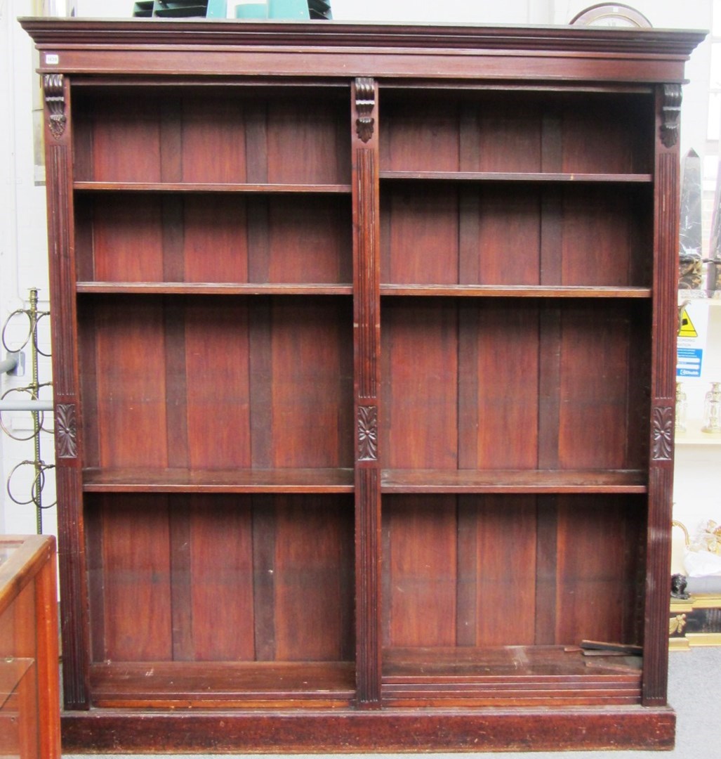 Appraisal: An Edwardian mahogany floor standing double section open bookcase cm