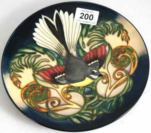 Appraisal: Moorcroft Plate decorated with a Fantail Bird signed Philip Gibson