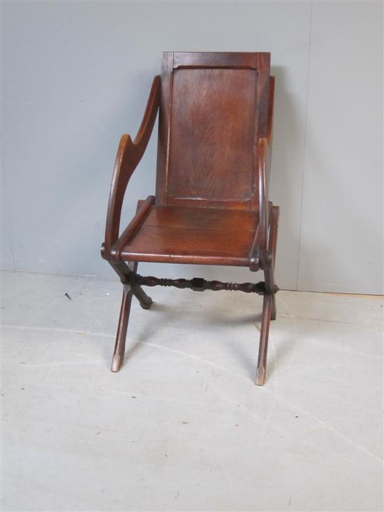 Appraisal: Oak Glastonbury style chair with rectangular panelled back shaped supports