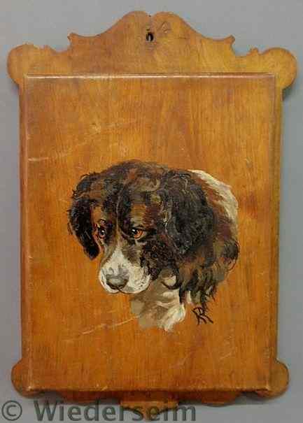 Appraisal: Pine hanging magazine rack with a painted dog's face and