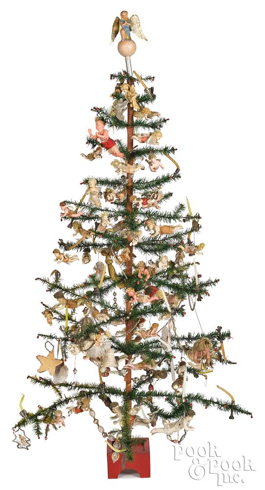 Appraisal: Decorated German feather tree Decorated German feather tree filled with