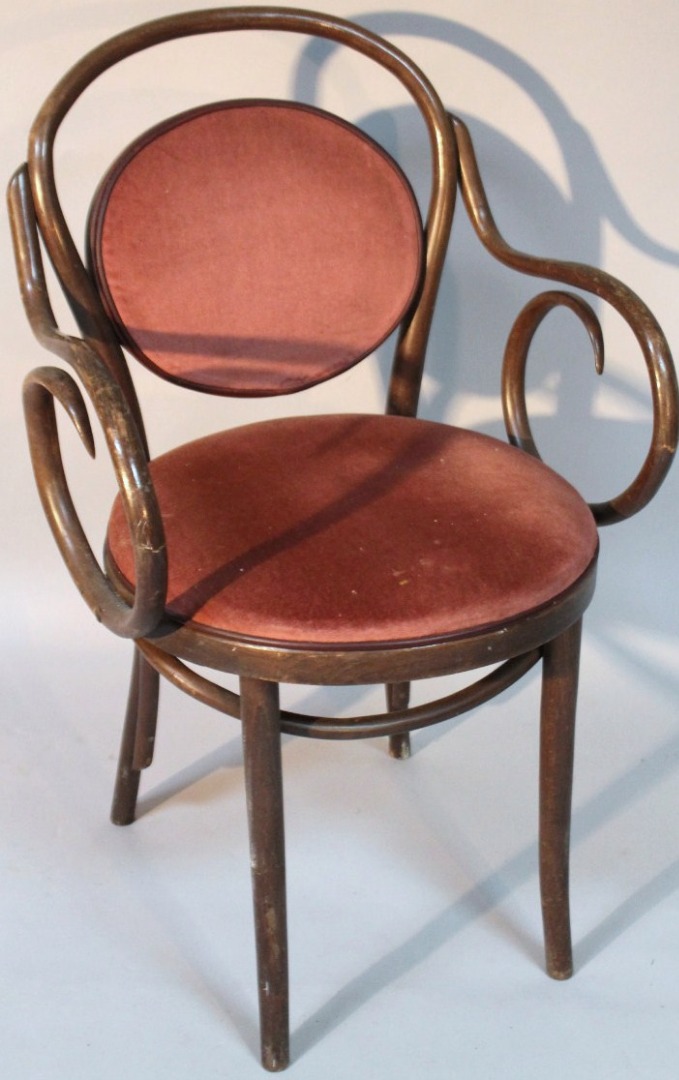 Appraisal: A 's stained beech bentwood armchair with an overstuffed seat