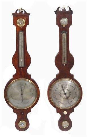 Appraisal: A GEORGIAN STYLE MAHOGANY WHEEL BAROMETER with break arch pediment