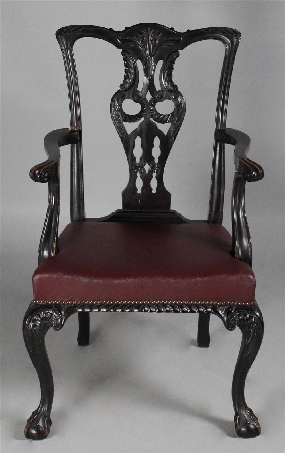 Appraisal: GEORGE III STYLE MAHOGANY ARM CHAIR with shaped cresting over