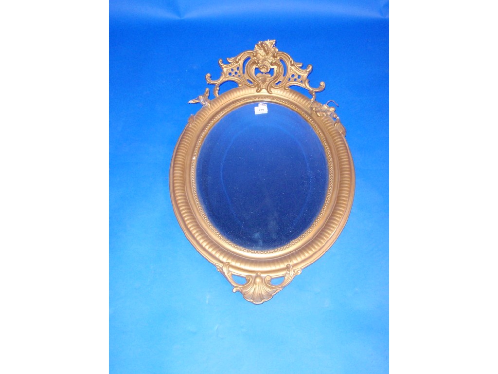 Appraisal: A late Victorian oval wall mirror with gilt plaster framing