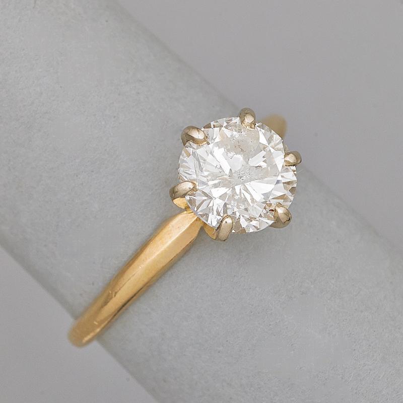 Appraisal: DIAMOND K GOLD SOLITAIRE RING Circular brilliant cut diamond with