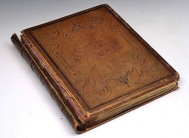 Appraisal: A VICTORIAN SCRAPBOOK contained within a tooled leather diary dated