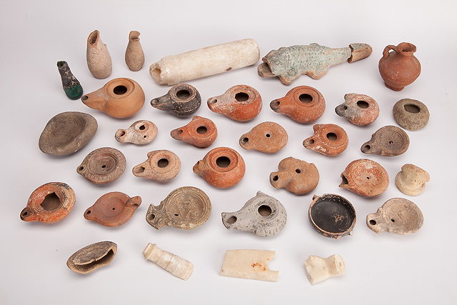 Appraisal: A COLLECTION OF THIRTY FOUR ROMAN AND MIDDLE EASTERN ARTIFACTS