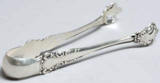 Appraisal: Pair Simmons Brothers Silver Sugar Tongs Of Chippendale style ending