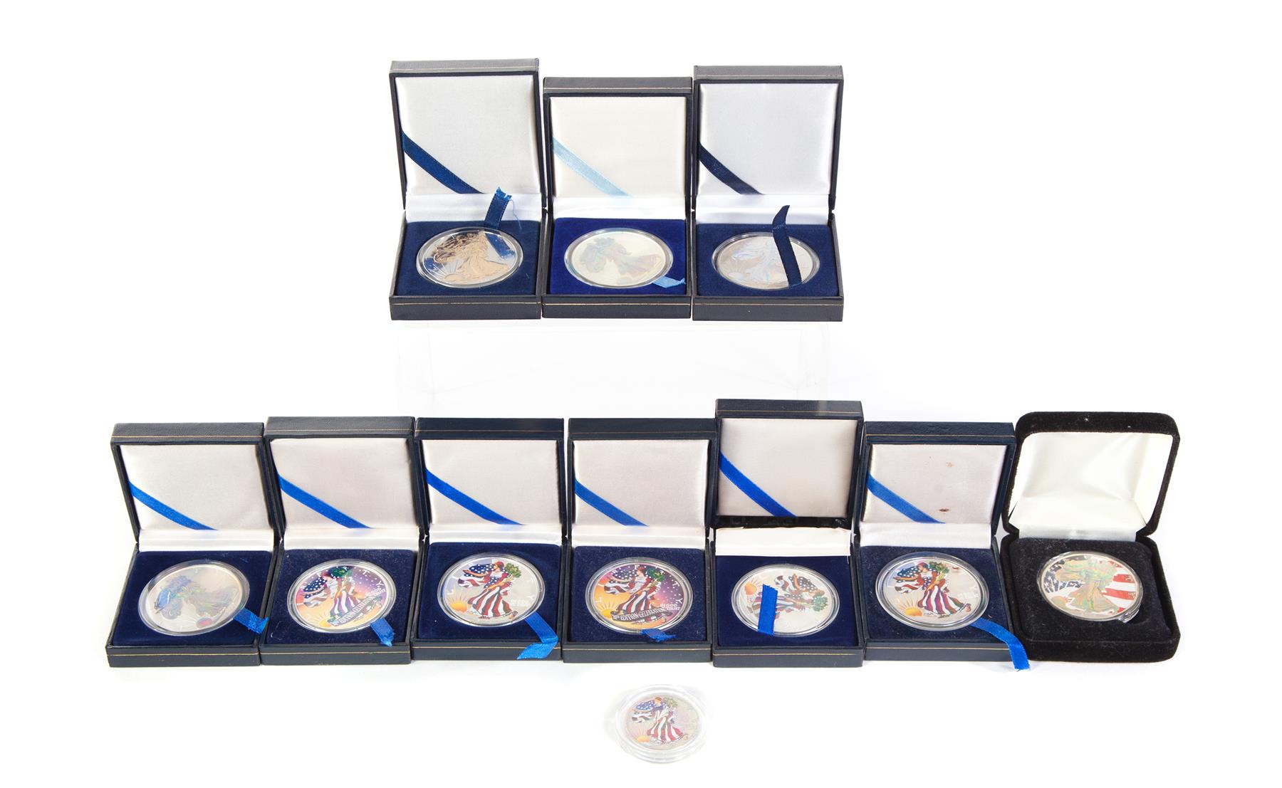 Appraisal: ELEVEN ALTERED SILVER COINS Ten American Silver Eagles one two-tone