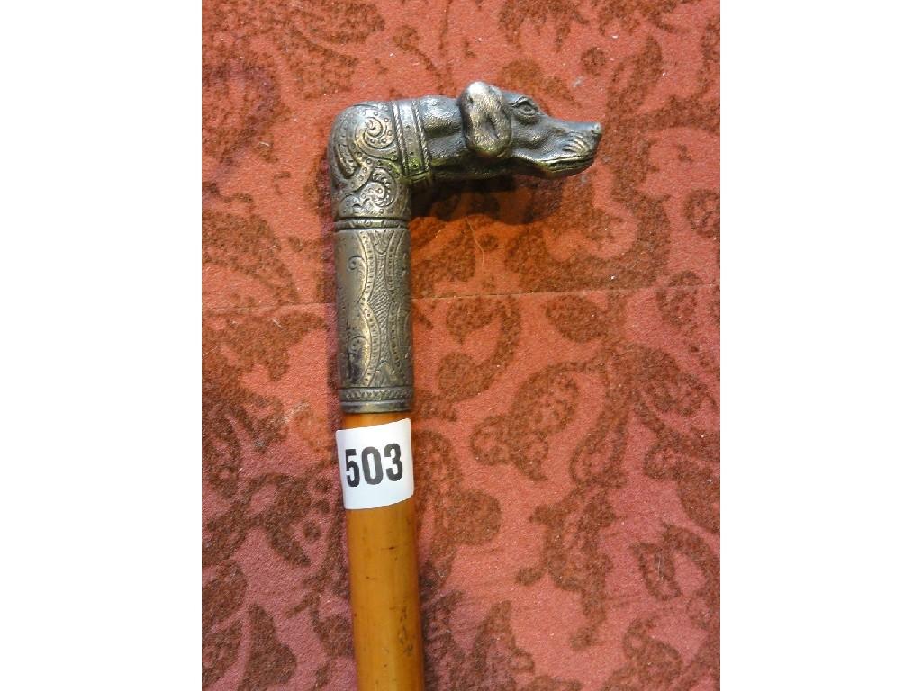 Appraisal: A gentleman's walking cane with a white metal knop with