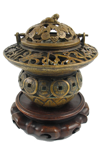 Appraisal: CHINESE BRONZE HAND LANTERN with bail handle the censor-like pierced