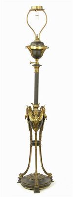 Appraisal: A gilt brass and bronze adjustable standard lamp the swan