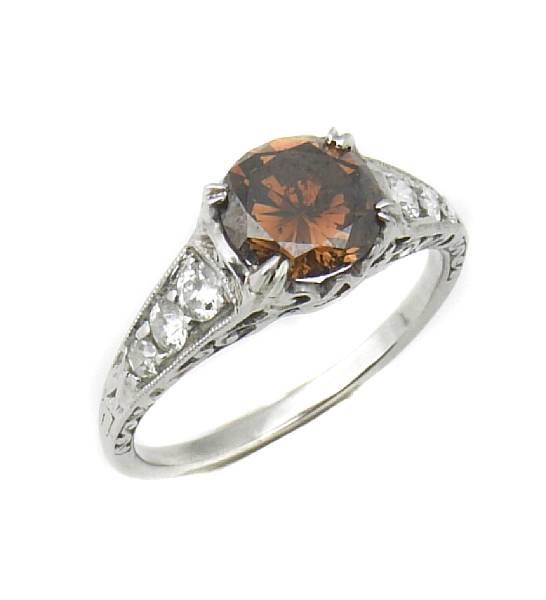 Appraisal: A colored diamond diamond and platinum ring a brown colored