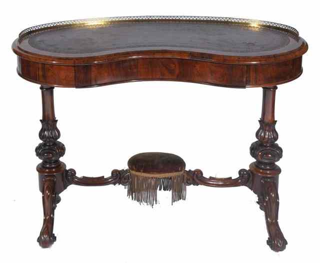 Appraisal: A VICTORIAN WALNUT KIDNEY SHAPED WRITING TABLE with gilt metal