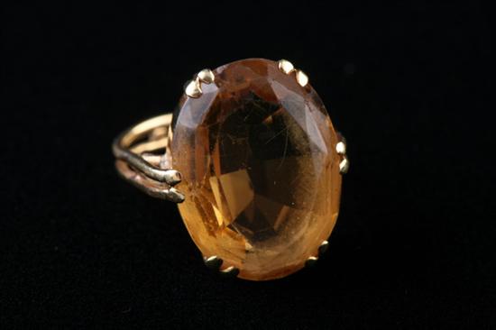 Appraisal: CONTINENTAL K YELLOW GOLD AND CITRINE RING Oval golden yellow