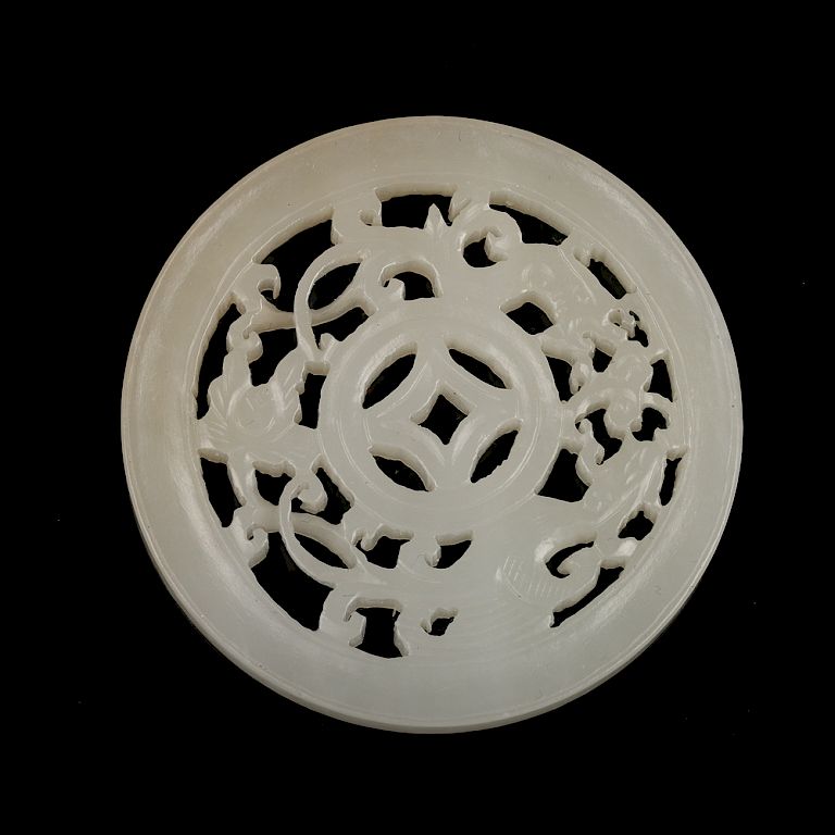 Appraisal: CHINESE WHITE JADE CARVED CIRCULAR PENDANT Elegantly carved in bilateral