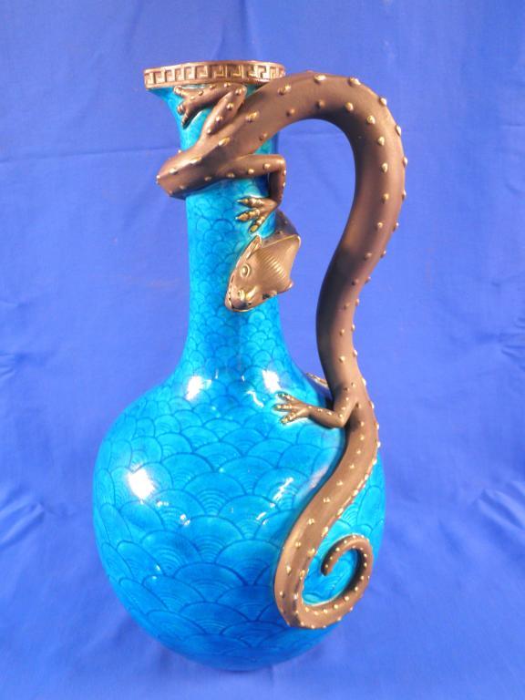 Appraisal: A thC Royal Worcester turquoise glazed ewer decorated in the