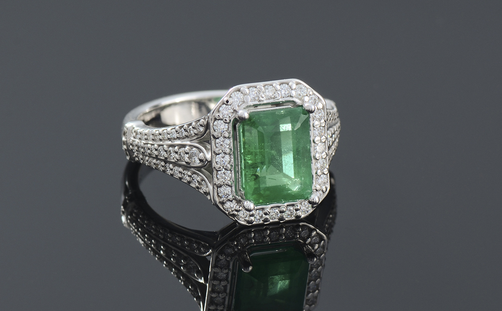 Appraisal: EMERALD DIAMOND RING K white gold ring centering a Ct