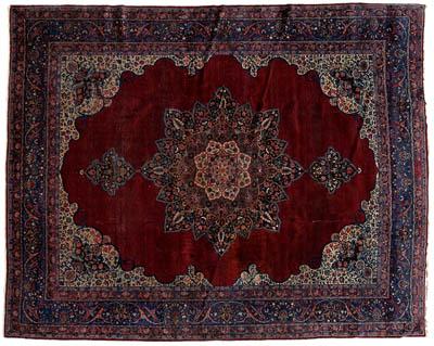 Appraisal: Kerman rug central medallion on burgundy field with elaborate corner