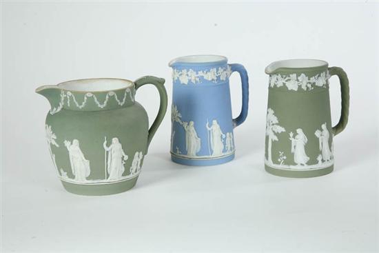 Appraisal: THREE WEDGWOOD PITCHERS All Jasperware with classical scenes Two green