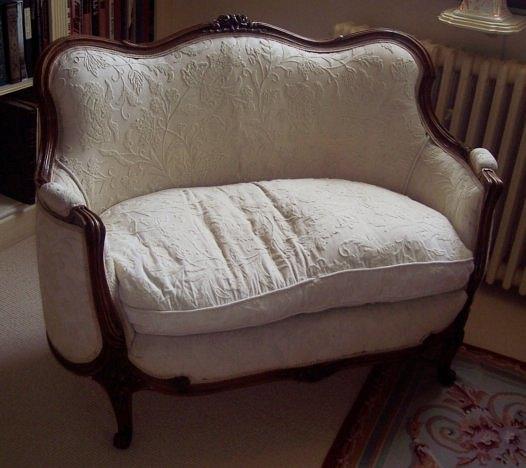 Appraisal: A French beechwood settee with carved moulded frame and serpentine