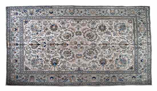 Appraisal: A Persian Tabriz having allover foliate decoration on a taupe