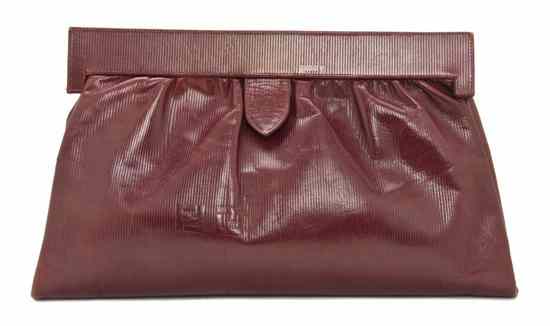 Appraisal: A Fendi Red Leather Clutch with leather shoulder strap Stamped