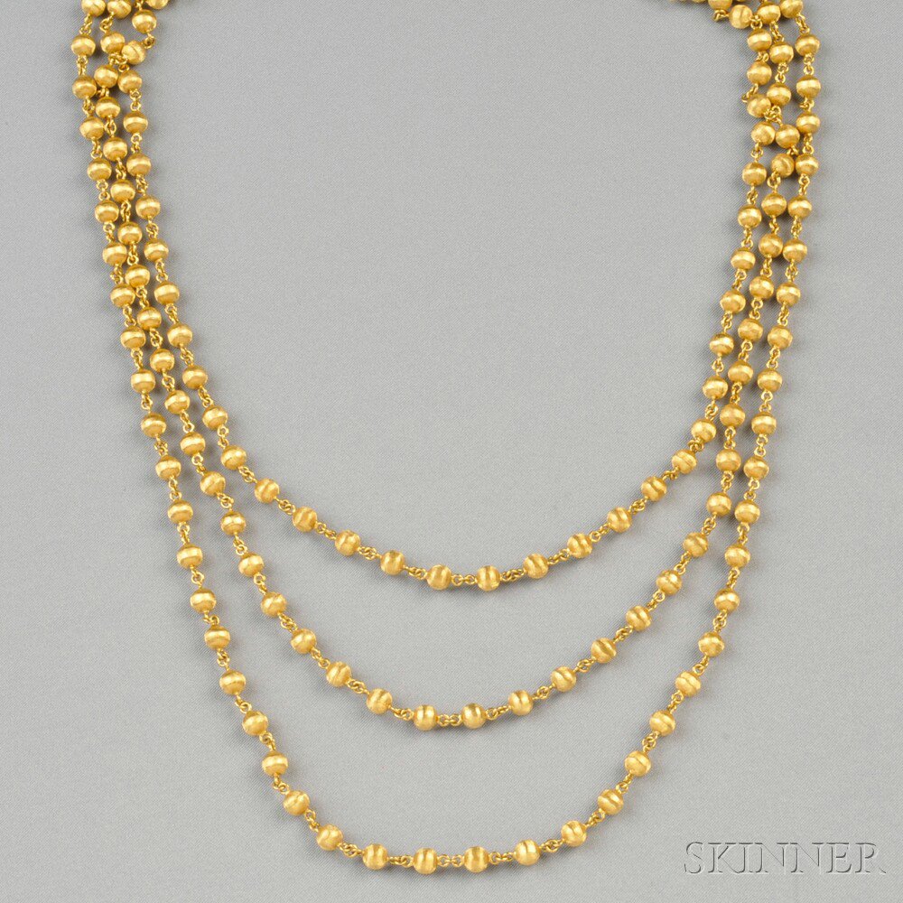 Appraisal: kt Gold Bead Necklace composed of engraved gold beads dwt