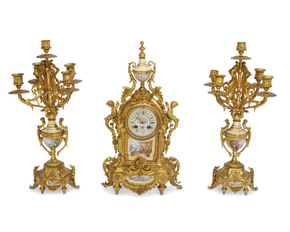 Appraisal: A FRENCH SAMUEL MARTIE PORCELAIN AND BRONZE CLOCK SETA French