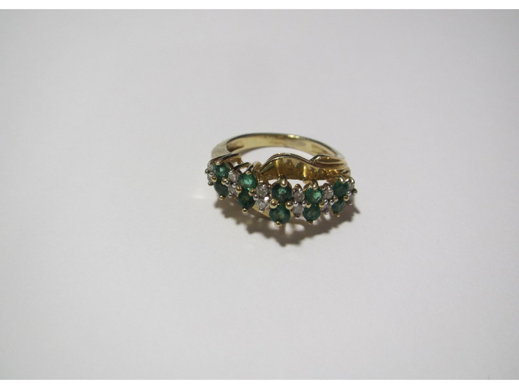 Appraisal: An emerald and diamond ring of contemporary design with alternating