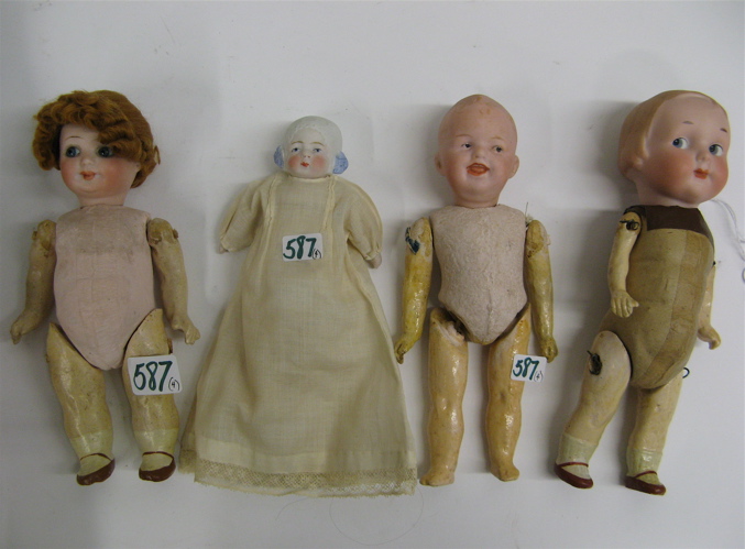 Appraisal: FOUR GERMAN BISQUE HEAD SMALL DOLLS Armand Marsailles boy molded