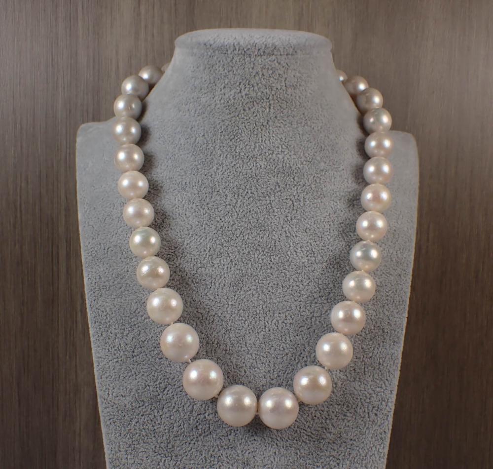 Appraisal: SOUTH SEA PEARL AND EIGHTEEN KARAT GOLD NECKLACE hand-knotted strand