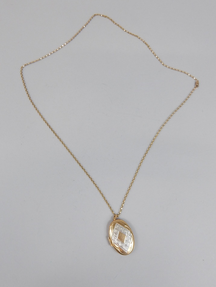 Appraisal: A locket and chain the locket designed with diamond shaped