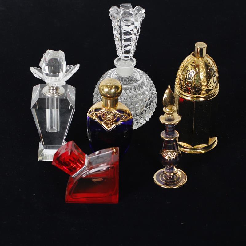 Appraisal: Collection of six perfume bottles some with perfume Includes Avon