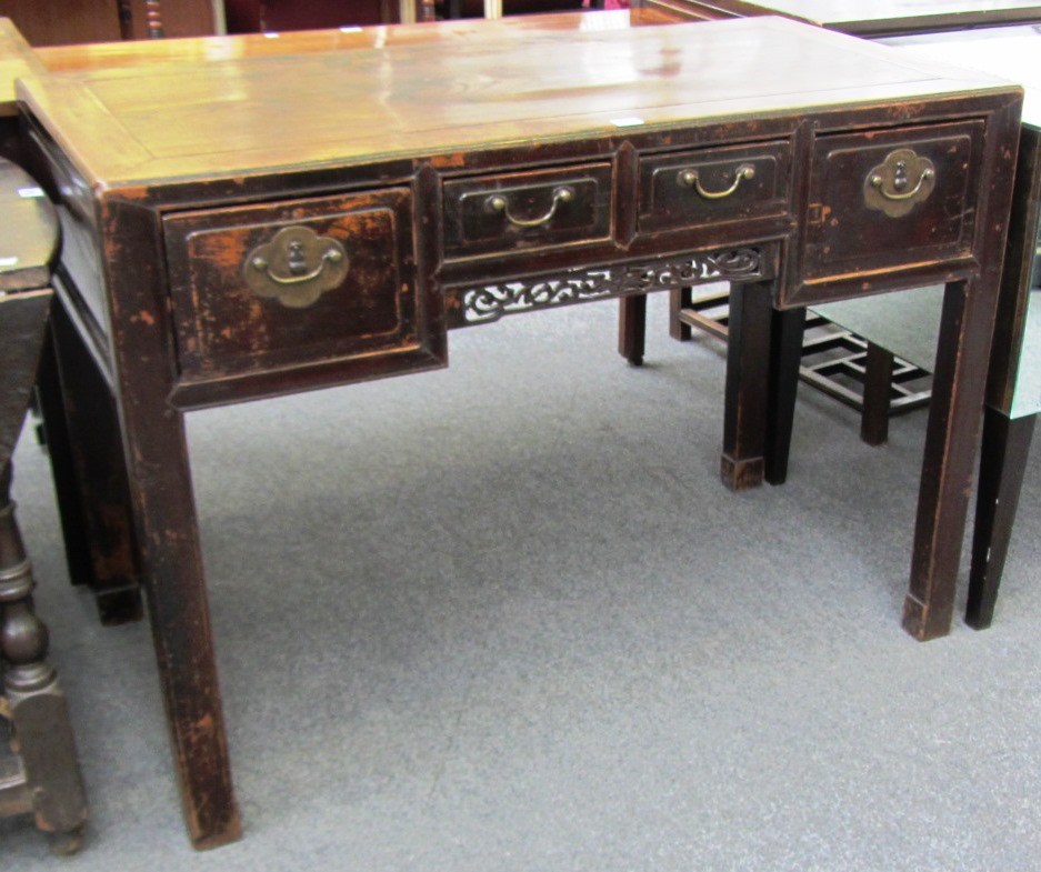 Appraisal: A late th century Chinese elm four drawer writing table