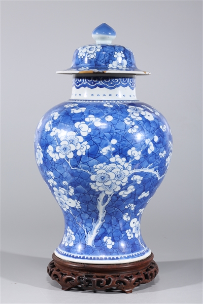 Appraisal: Chinese blue and white porcelain covered vase with allover blossoms