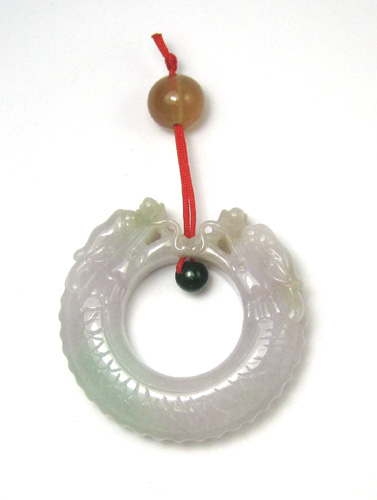 Appraisal: CHINESE JADE DOUBLE HEADED DRAGON PENDANT having a red cord