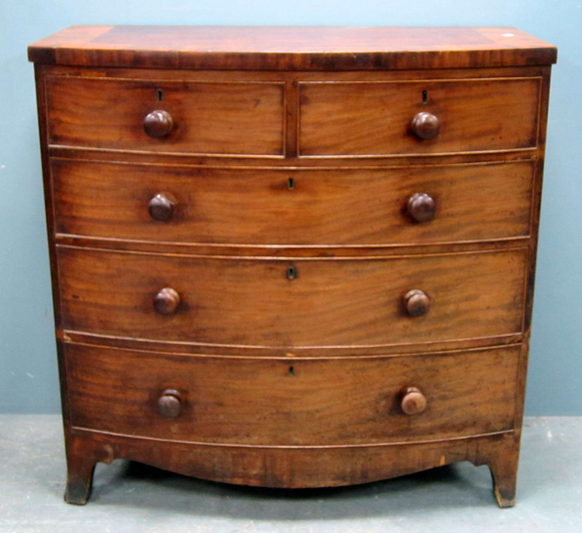 Appraisal: th century mahogany bowfront chest of two short over three