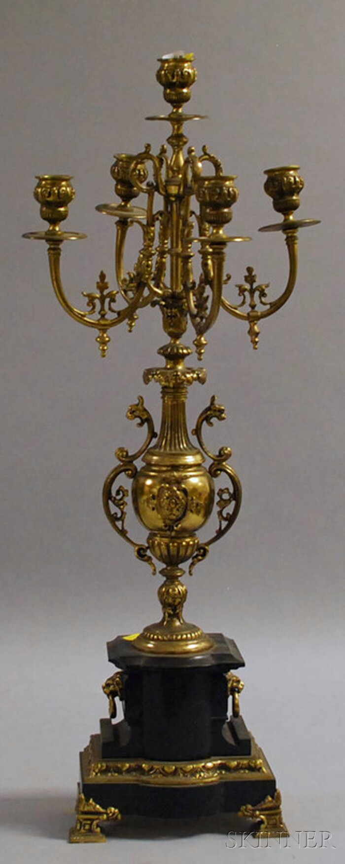 Appraisal: Renaissance Revival-style Brass and Black Marble Five-light Candelabra