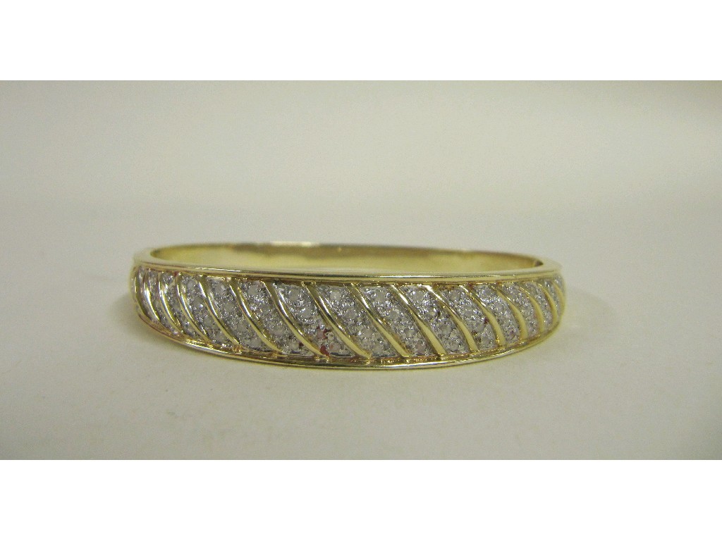 Appraisal: Nine carat gold diamond set bangle Approx gms one stone