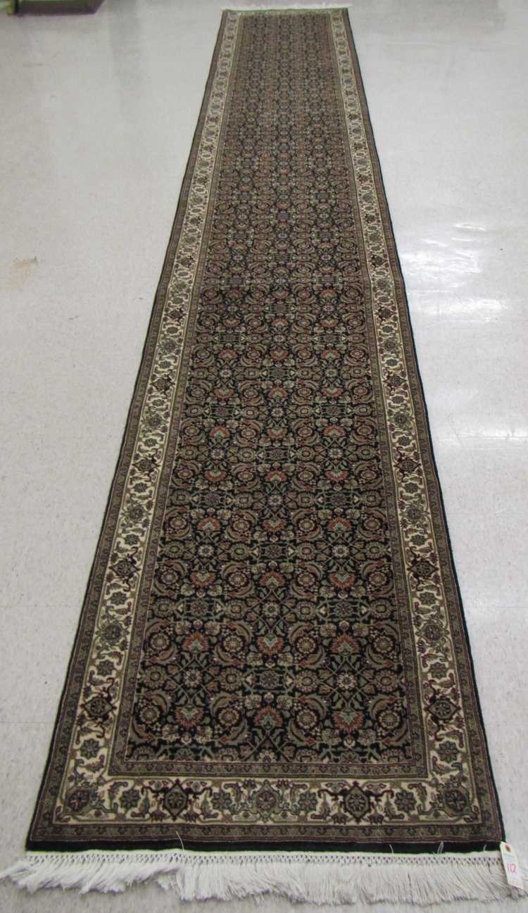 Appraisal: HAND KNOTTED ORIENTAL CORRIDOR RUG Indo-Persian overall Herati floral design