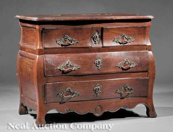 Appraisal: A Louis XV Carved Walnut Bomb Commode serpentine molded top