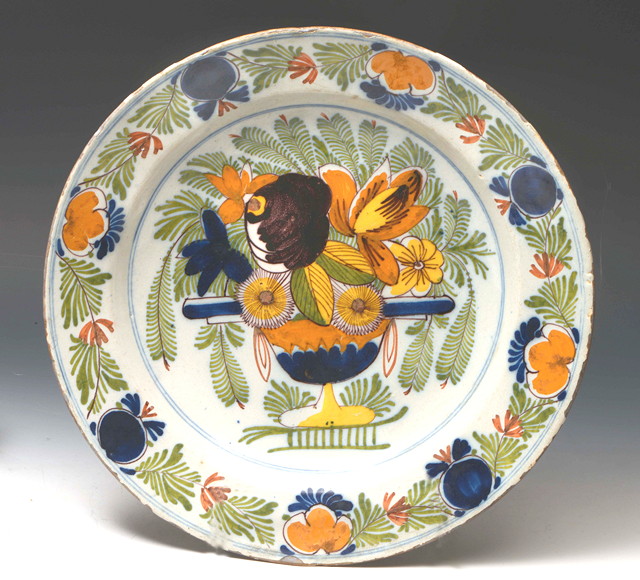 Appraisal: AN OLD CONTINENTAL TIN GLAZED CHARGER decorated in coloured enamels