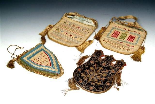 Appraisal: FOUR TURKISH WOVEN PURSES decorated in silver and gold thread