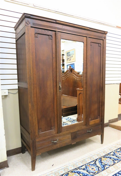 Appraisal: TWO-DOOR OAK WARDROBE Belgian c the larger center door inset