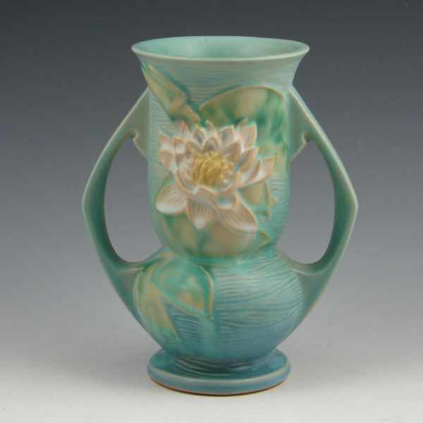 Appraisal: Roseville Water Lily handled vase in blue Based on underglaze