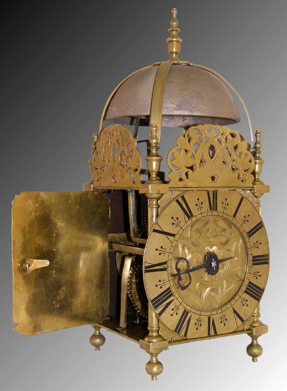 Appraisal: Interesting antique brass lantern clock the chapter ring enclosing a