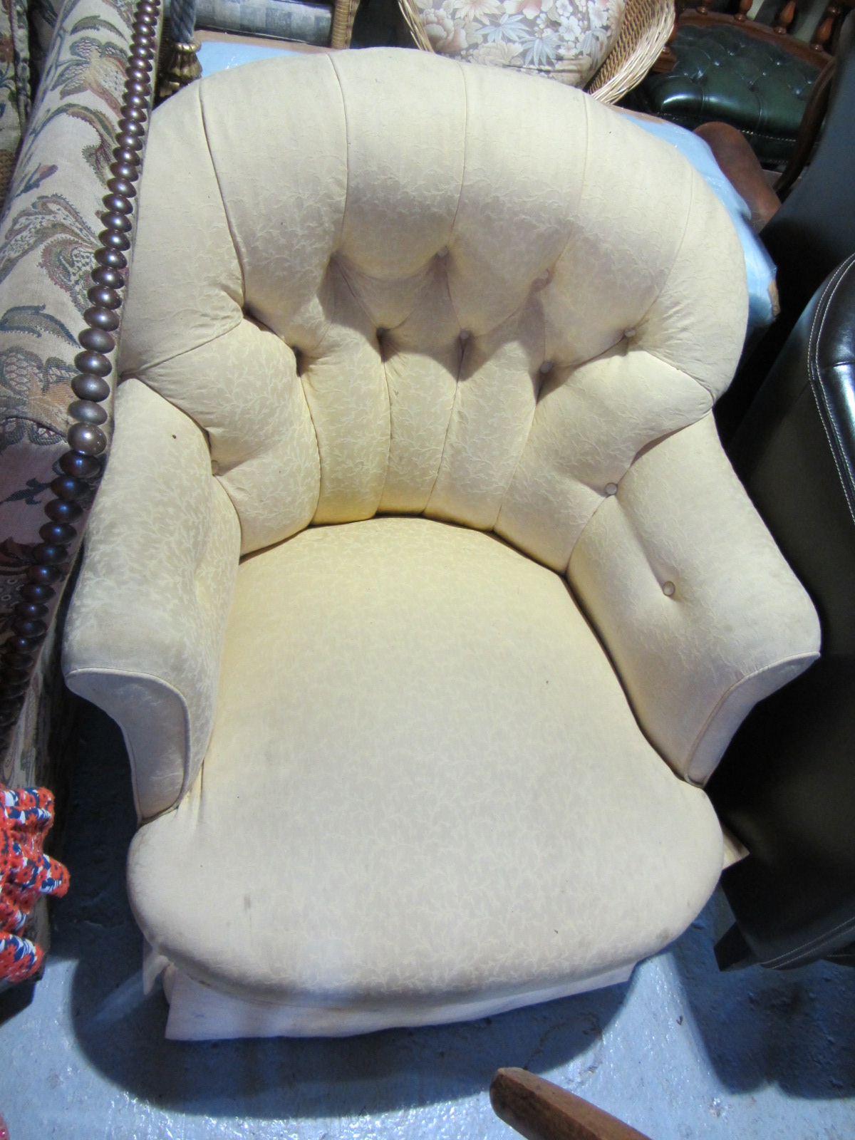 Appraisal: A th century oak framed button back tub chair