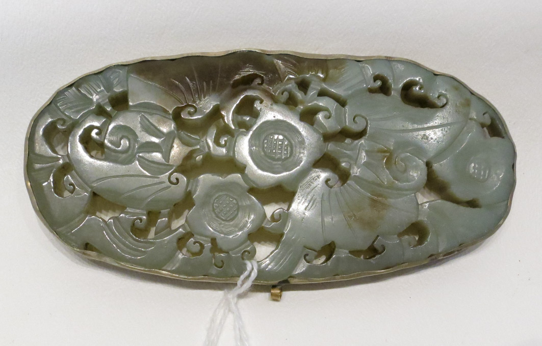 Appraisal: CARVED JADEITE PENDANT MEDALLION pierced with floral and leaf motif